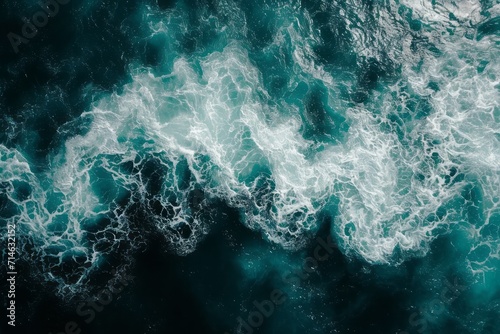 Spectacular aerial top view background photo of ocean sea water white wave splashing in the deep sea. Drone photo backdrop of sea wave in bird eye waves