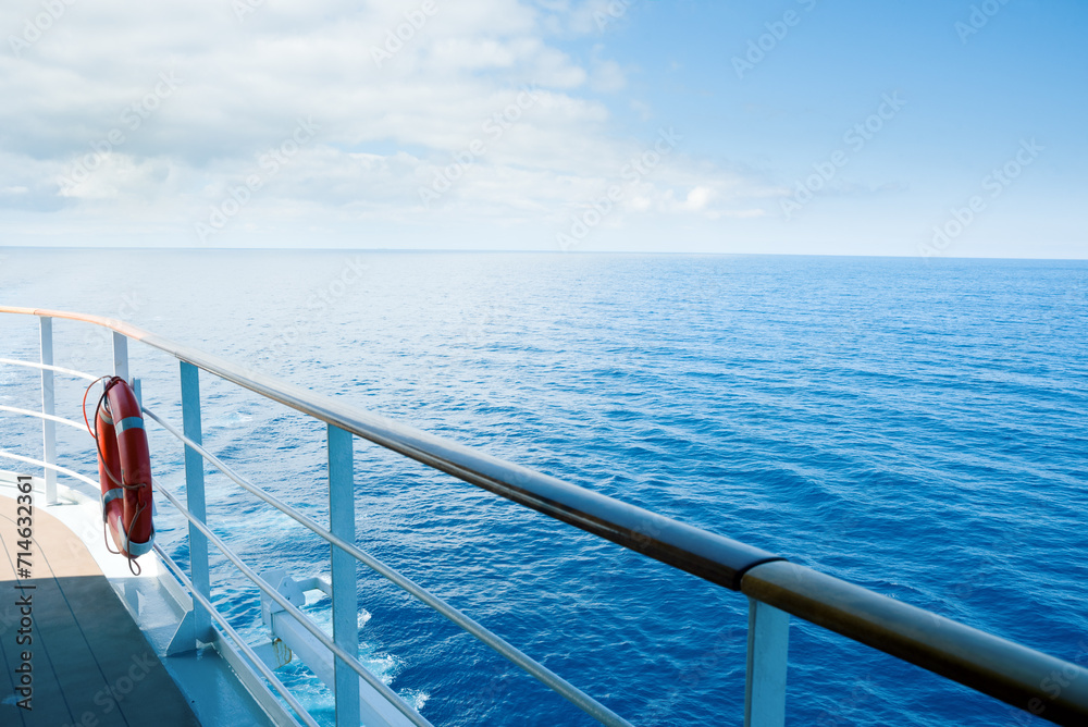 View of still blue sea from ship deck