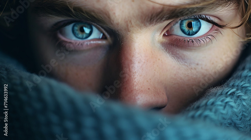 a close up of a person with blue eyes looking at the camera