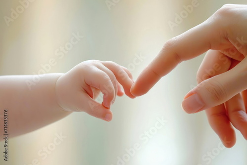 baby touch mom finger