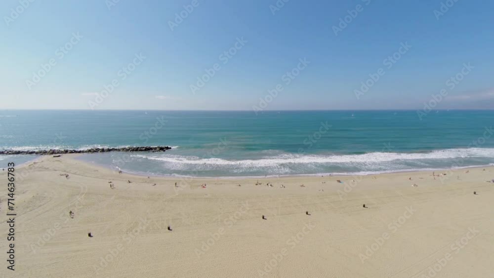 Pacific ocean beach with people get rest on sand at autumn Pacific ocean beach with people get rest on sand at autumn
