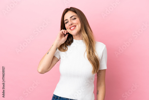 Caucasian woman isolated on pink background laughing