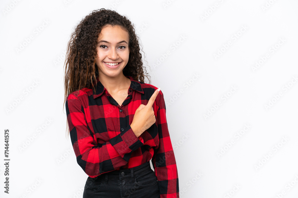 Young Arab woman isolated on white background pointing to the side to present a product Young Arab woman isolated on white background pointing to the side to present a product