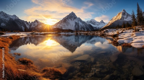 Breathtaking Alpine Sunrise Reflecting on a Tranquil Lake