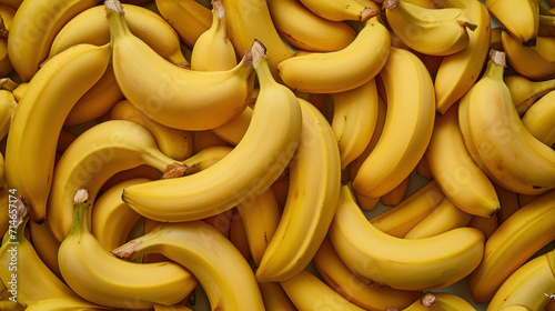  a large pile of ripe bananas sitting on top of a pile of other bananas in a pile on top of a pile of other bananas on top of a table.