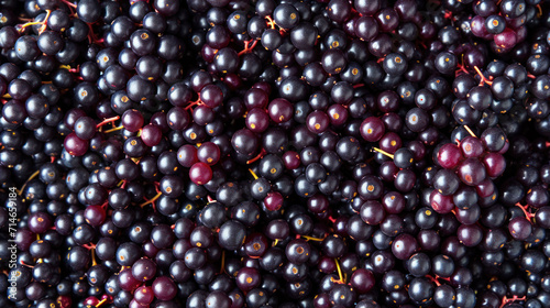  a close up of a pile of blackberries with red berries on the top of the berries and the bottom of the berries on the bottom of the pile of the pile.