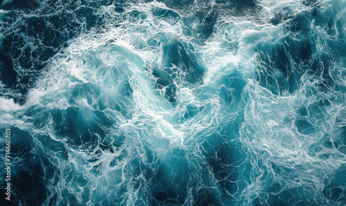 Aerial view to ocean waves. Blue water background