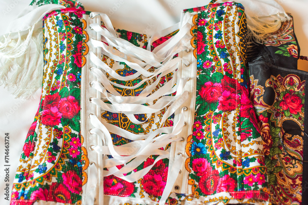 Ethnic embroidered corset, flowers details. Concept of beauty Slavic women, Boho style Ethnic embroidered corset, flowers details. Concept of beauty Slavic women, Boho style