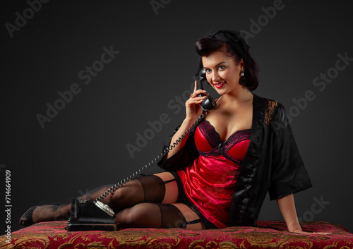 Konstfotografi Beautiful woman speaking via vintage phone.
