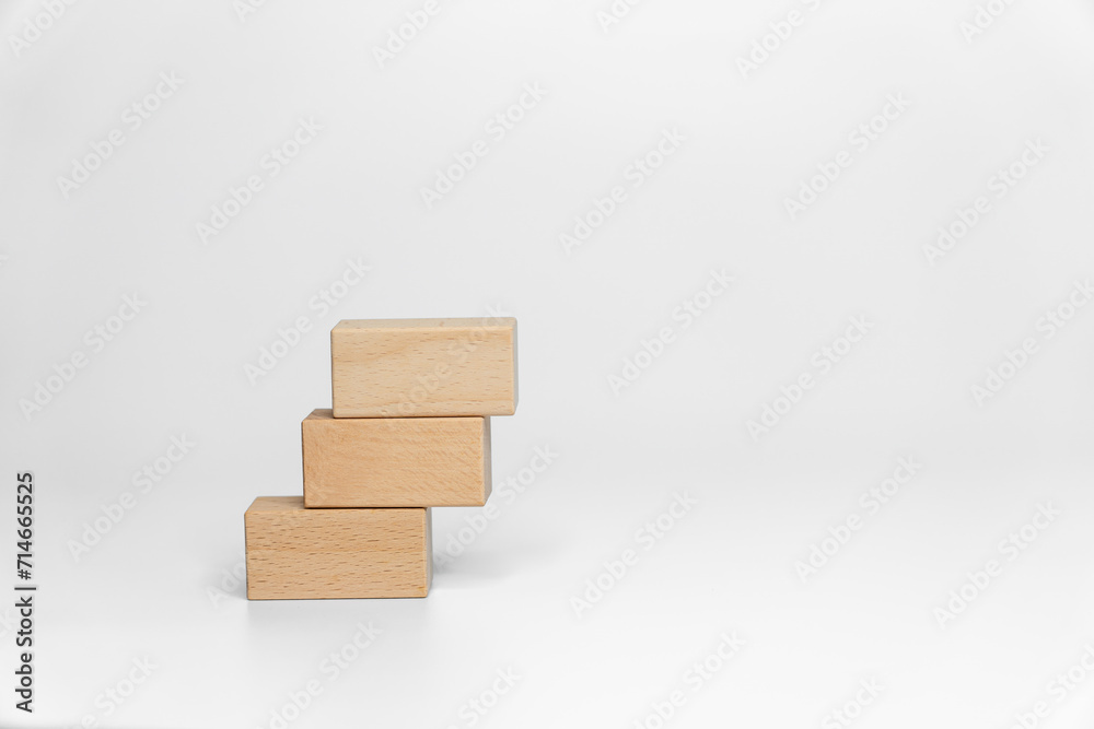 building wood blocks on white background; business or creative concept building wood blocks on white background; business or creative concept