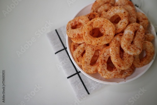 Krupuk setan or hot spicy ring shaped snack. Crispy snack with chilli powder. very hot and spicy. 