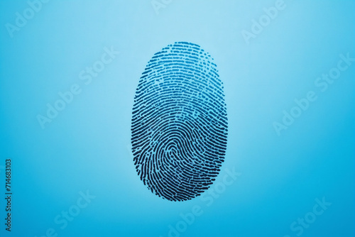 A single fingerprint is displayed on a vibrant blue background - Concept for security