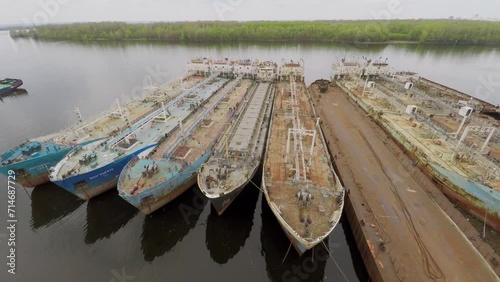 Moorage with several tankers in Volga river at spring cloudy day photo