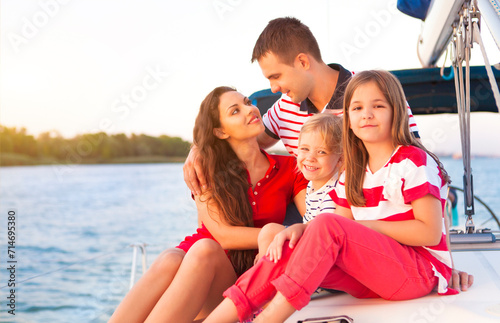 Beautiful family with two daughters having great time at the yacht © Dasha Petrenko