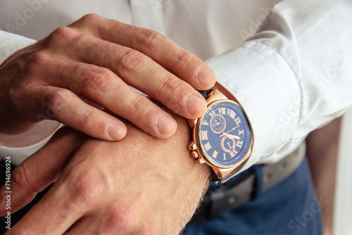 A man checking a wristwatch closeup
