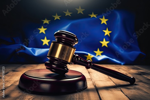 European judge\'s hammer. Laws of the European Union. European flag on the background.