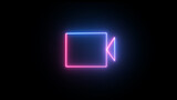 Glowing neon line video camera icon. Glowing neon line video camera icon isolated on black background.