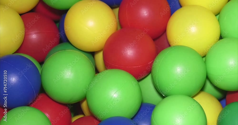Multi-colored children's balls in close-up video
Multi-colored children's balls in close-up video