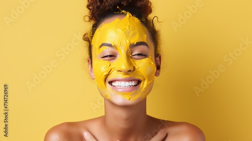 Smiling woman with cosmetic mask against vibrant backdrop, ample text space - beauty concept