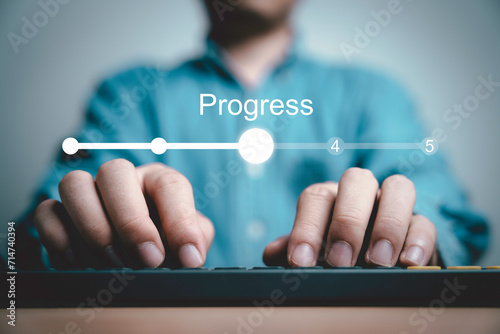 Businessman using computer keyboard to update status in checklist to remind work task progressive for project develop management and tracking concept. photo