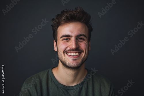 A man with a beard is smiling for the camera