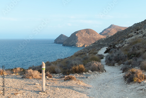 La Molata trail between Las Negras and El Playazo beach in Almería, Andalusia, Spain. Beautiful coastal route in the Cabo de Gata Natural Park on the shores of the Mediterranean Sea. photo