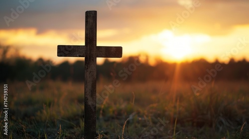 Cross in Field at Sunset