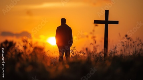 Man Standing by Cross at Sunset