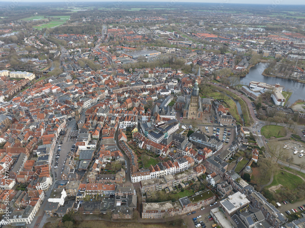Obraz premium Aerial overview of the city of Zutphen, along the river Ijssel in Gelderland, The Netherlands. Birds eye aerial drone view in the Dutch province of Gelderland.