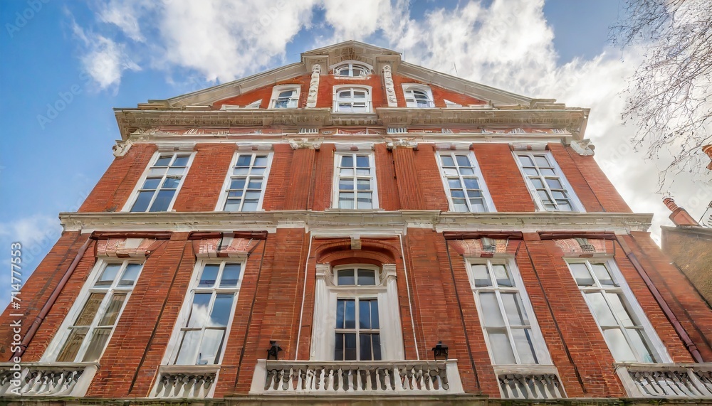 opulent restored elegant victorian period building in red bricks and white windows in south kensington london uk