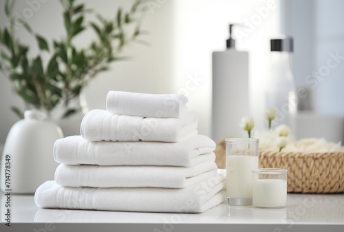 An arrangement of herbal bags and beauty treatment items displayed on a white wooden table in a spa setting.