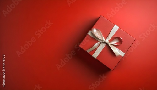 top view on red gift box for christmas or valentine s day on red background