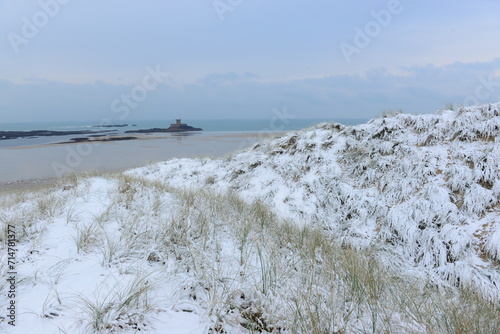 Jersey, U.K. St.Ouen's Bay and snow covered dunes.