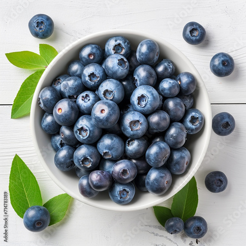 Bowl of fresh tasty blueberries with leaves on white wooden table  flat lay  ai technology