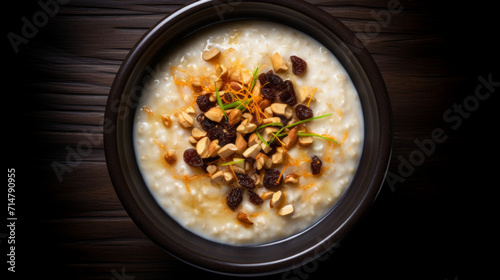 A bowl of creamy and aromatic Bubur Lambuk, a savory porridge made with rice, meat, and spices, perfect for breaking fast during Ramadan