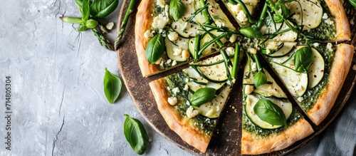 Green pizza with cauliflower, spinach, zucchini, and asparagus.