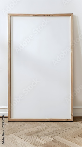 photo of a large wooden blank frame leaning against a white wall 