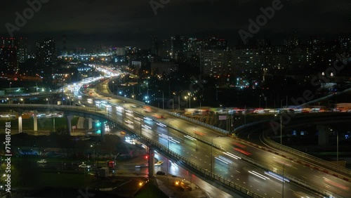 Time lapse. Night city highway stretching into the horizon.
