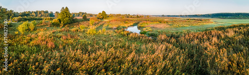 Sunrise among meadows and forests on the Suprasl River in Podlasie on an autumn,september day.