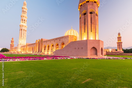 The Sultan Qaboos Grand Mosque low angle view in golden hour photo