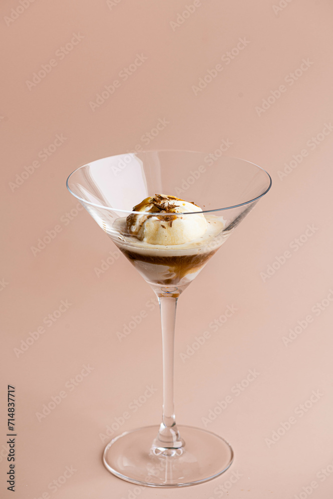 Italian affogato in a glass goblet. Ice cream and coffee, selective focus Italian affogato in a glass goblet. Ice cream and coffee, selective focus