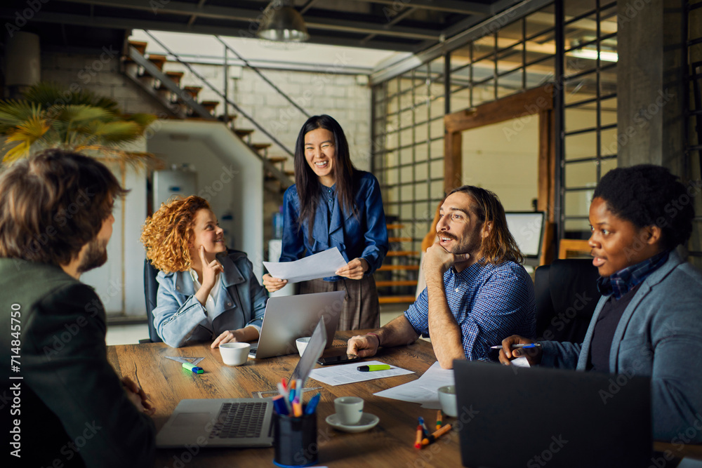 Multicultural team working together in modern office space