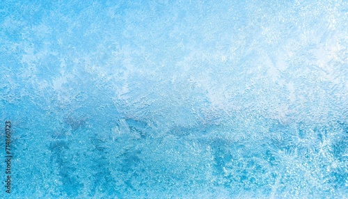winter frosted window glass blue color background photo