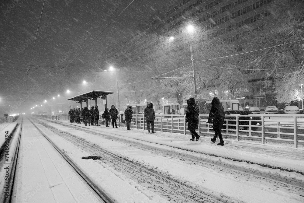 People in traffic through snow in Bucharest, Romania, January 20, 2024
