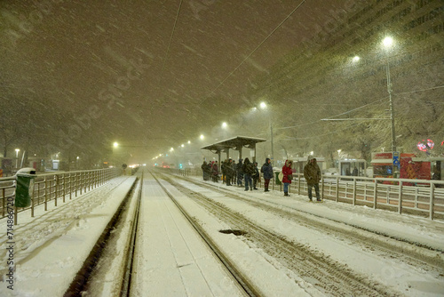 Obraz na płótnie People in traffic through snow in Bucharest, Romania, January 20, 2024 w salonie