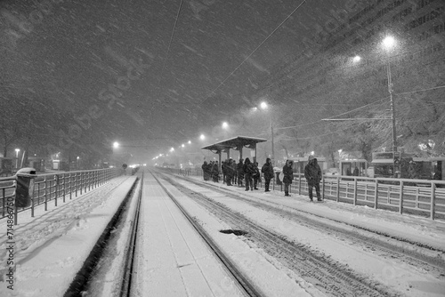 Obraz na płótnie People in traffic through snow in Bucharest, Romania, January 20, 2024 w salonie