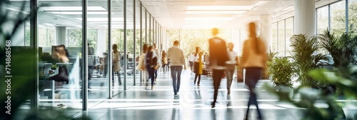 Businesspeople walking at modern office. Concept work process. Business workplace with people in walking in blurred motion in modern office space.