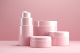 Set of beauty products in a row on white table against pink background