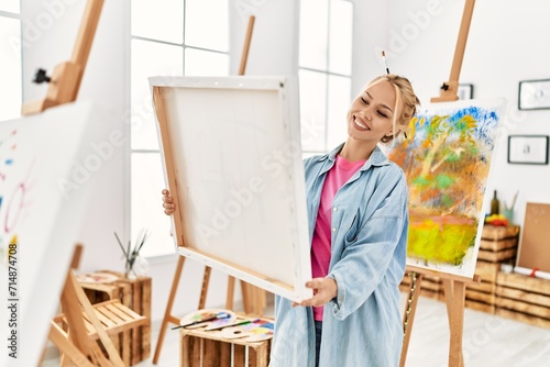 Young caucasian woman artist smiling confident looking draw at art studio