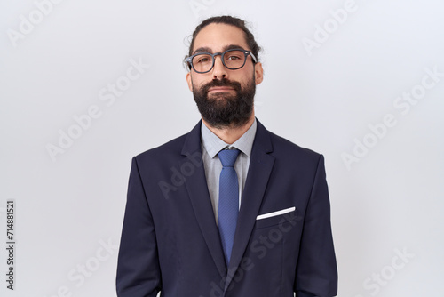 Hispanic man with beard wearing suit and tie depressed and worry for distress, crying angry and afraid. sad expression.